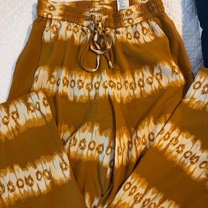 Rust and cream polyester wide leg pants with drawstring waist and pockets